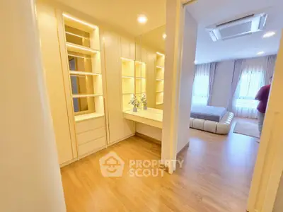 Spacious bedroom with elegant built-in storage and cozy lighting