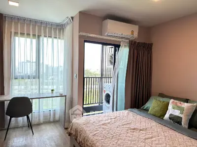 Modern bedroom with balcony view and stylish decor