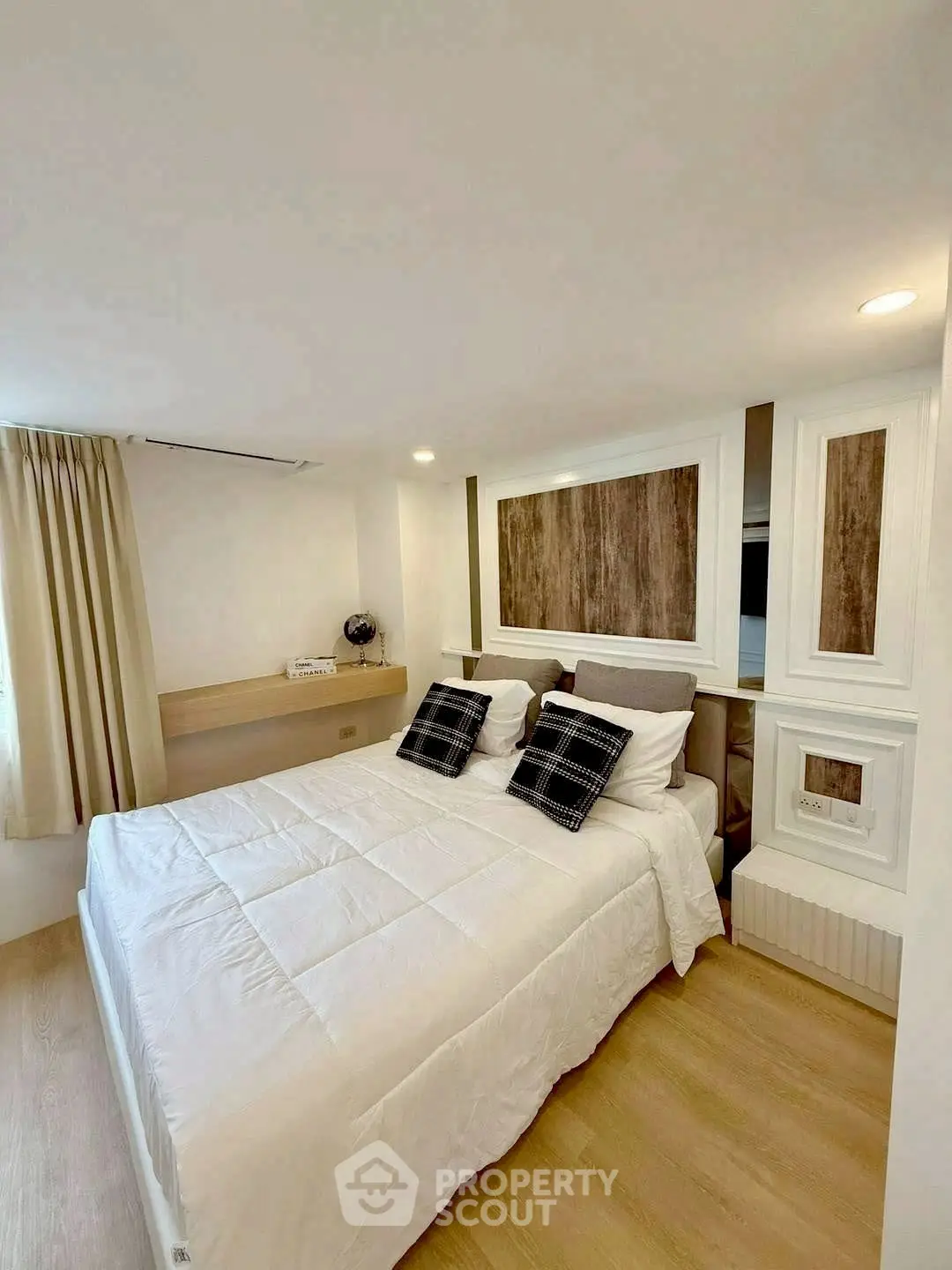 Cozy modern bedroom with stylish decor and natural light