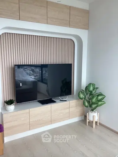 Modern living room with sleek TV unit and stylish decor