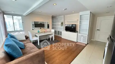 Spacious modern living room with elegant decor and city view, perfect for urban living.