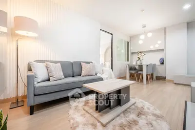 Modern living room with stylish decor and cozy dining area