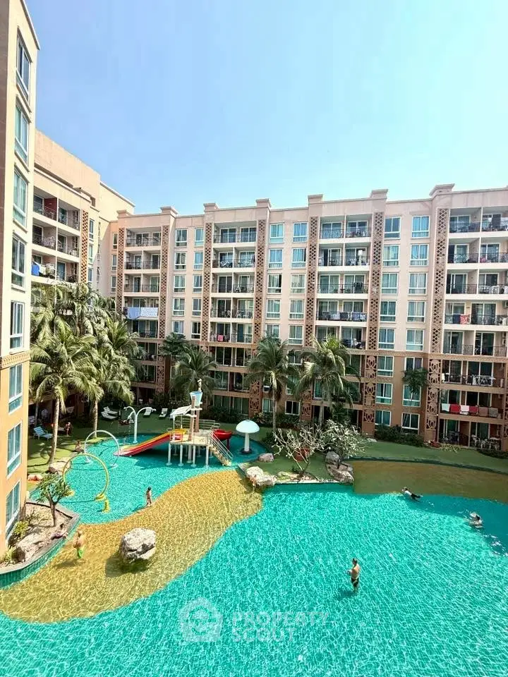 Luxurious apartment complex with stunning pool and lush landscaping