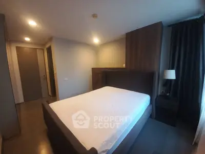 Spacious bedroom with modern furnishings and ample natural light
