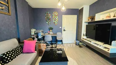 Stylish living room with modern decor and large TV in cozy apartment