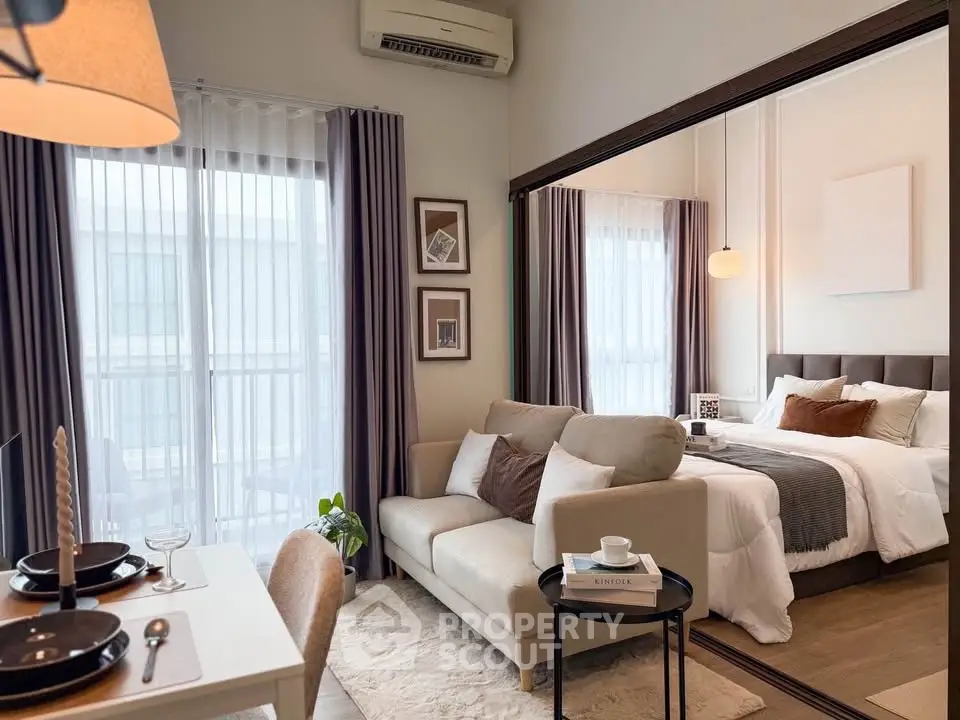 Modern studio apartment with cozy living area and stylish bedroom