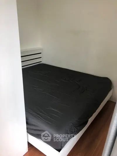 Cozy bedroom with minimalist design and wooden flooring