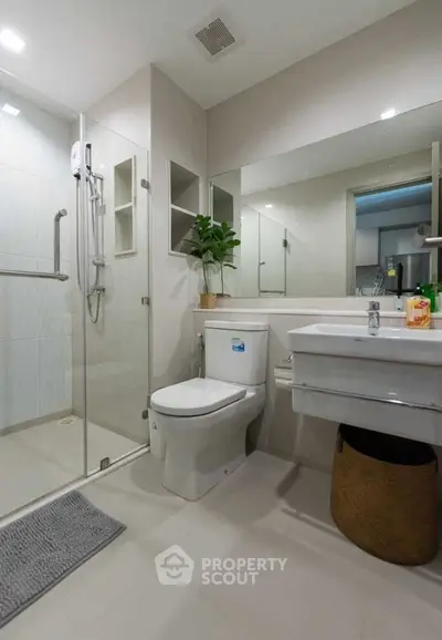 Modern bathroom with glass shower and sleek fixtures