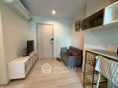 Modern living room with sleek furniture and air conditioning in a cozy apartment.