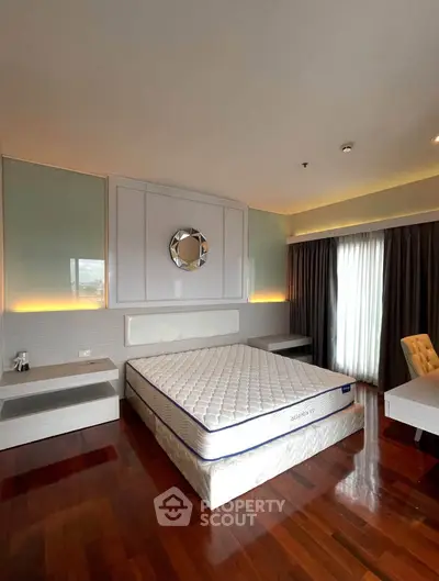 Luxurious bedroom with elegant decor and natural light