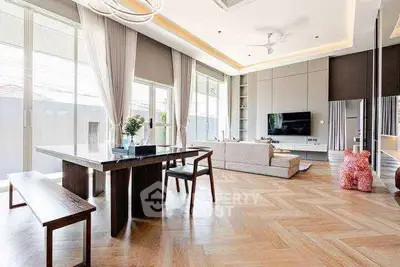 Spacious modern living room with elegant decor and large windows