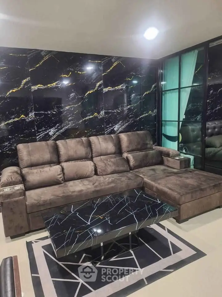 Luxurious living room with elegant marble accents and plush sectional sofa
