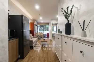 Stylish open-plan living room with modern decor and natural light