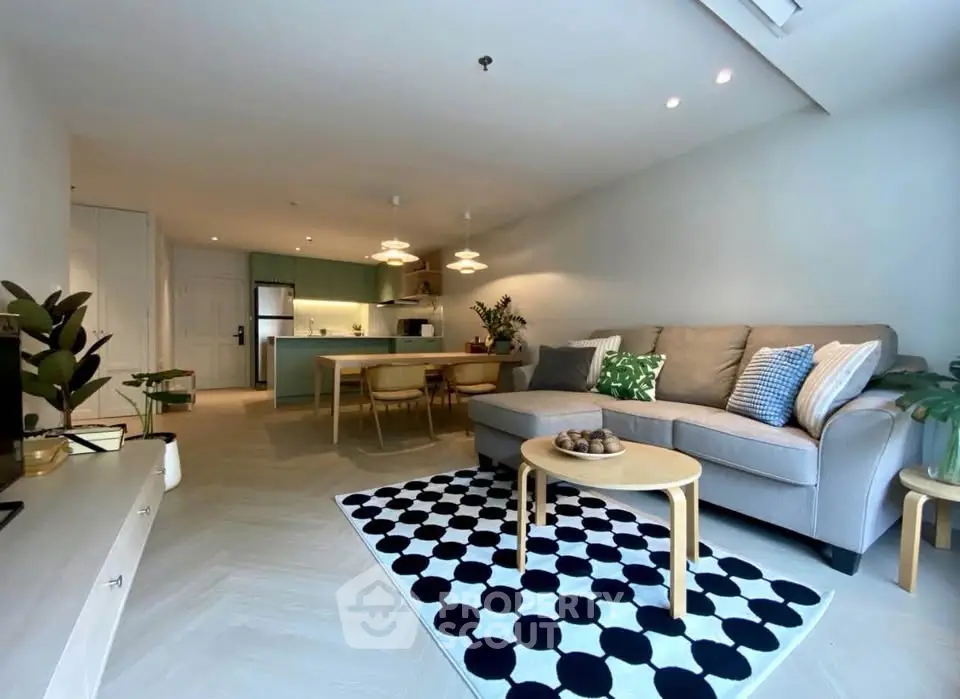 Spacious modern living room with open kitchen and stylish decor