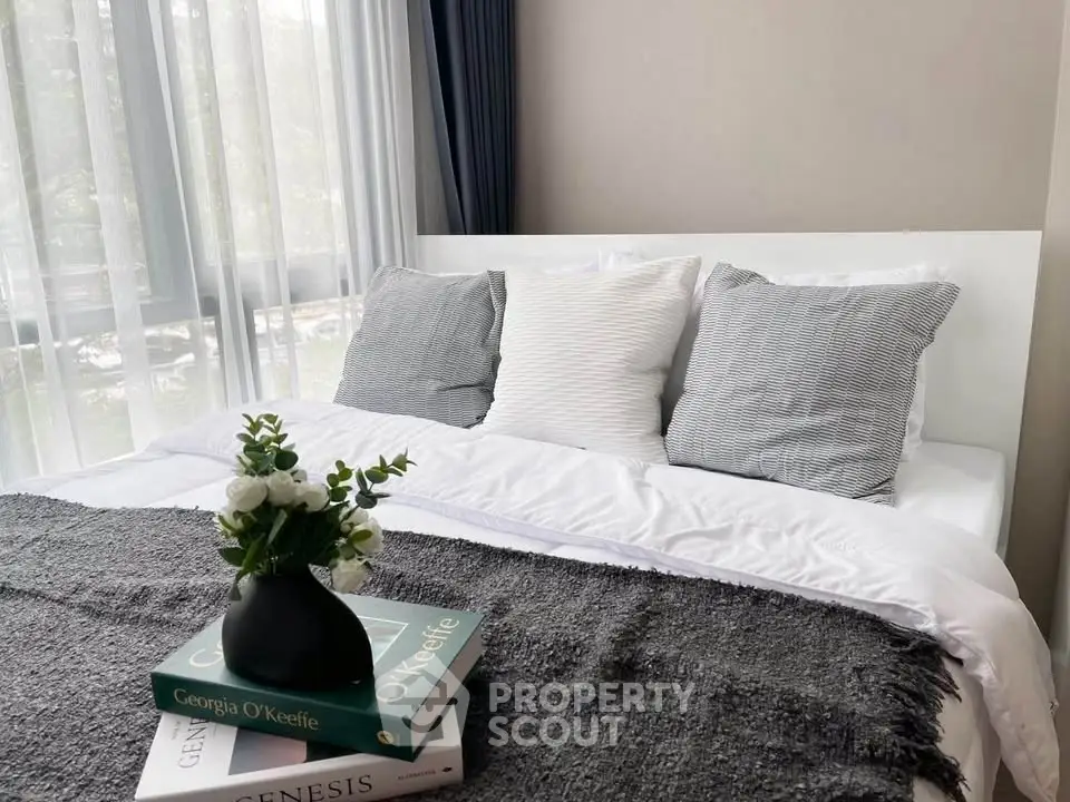 Cozy bedroom with stylish decor and natural light