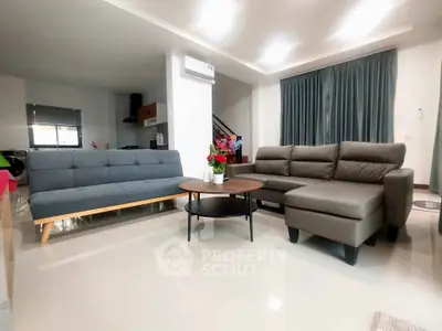 Spacious modern living room with stylish sofas and elegant decor