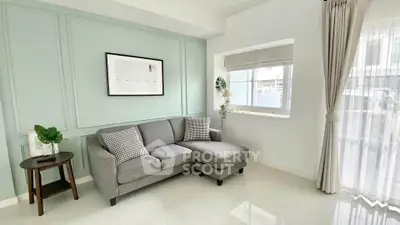 Elegant living room with modern gray sofa and chic decor