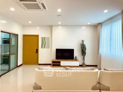 Spacious modern living room with sleek design and natural light