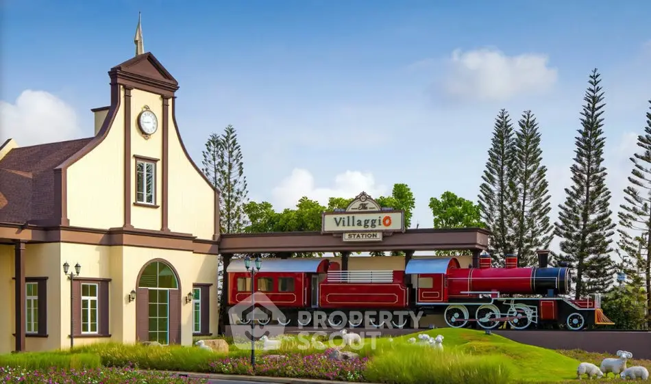 Charming vintage train station with lush landscaping and classic architecture.