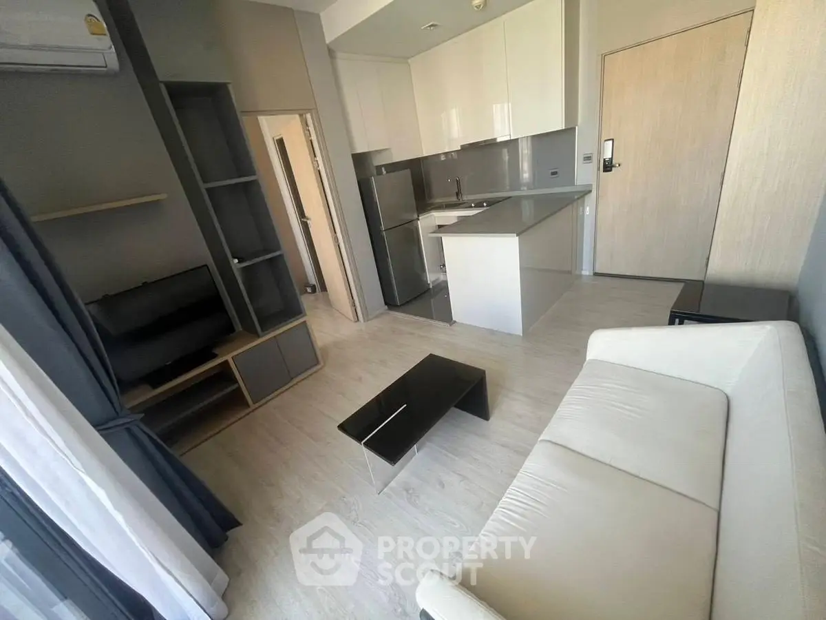 Modern living room with sleek kitchen in open layout apartment