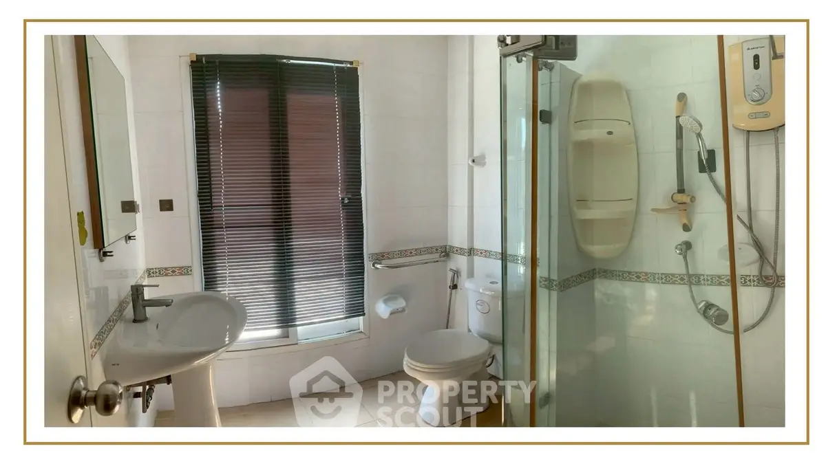 Modern bathroom with shower, toilet, and sink in a well-lit space.