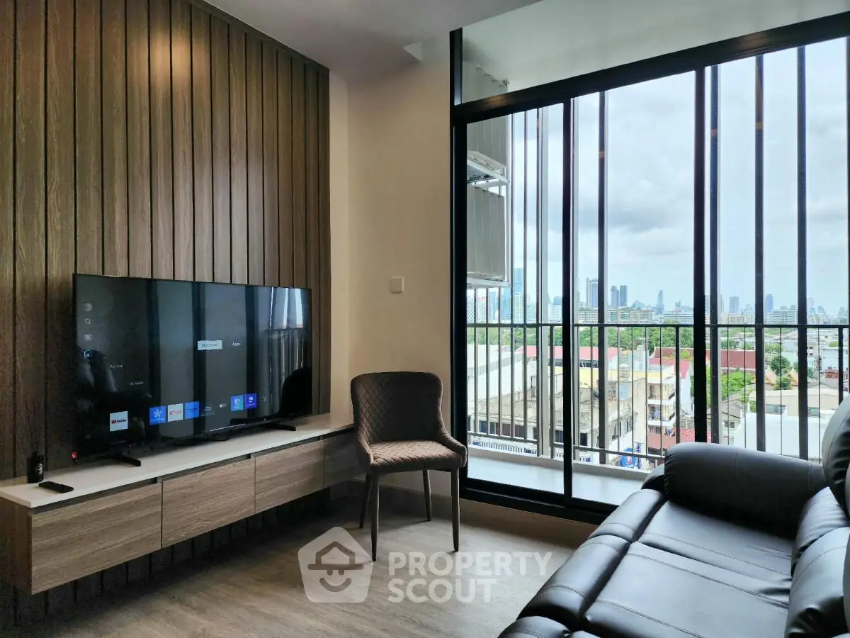 Modern living room with large windows and city view