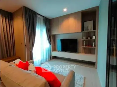 Modern living room with stylish decor and large TV unit