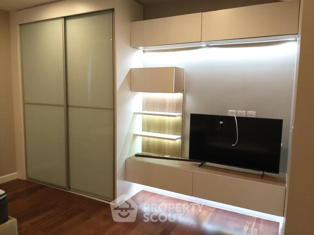 Modern living room with sleek TV unit and ambient lighting
