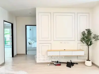 Modern minimalist living room with elegant wall paneling and sleek furniture