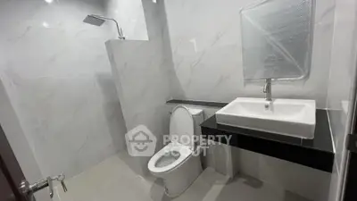 Modern bathroom with sleek fixtures and elegant marble tiles