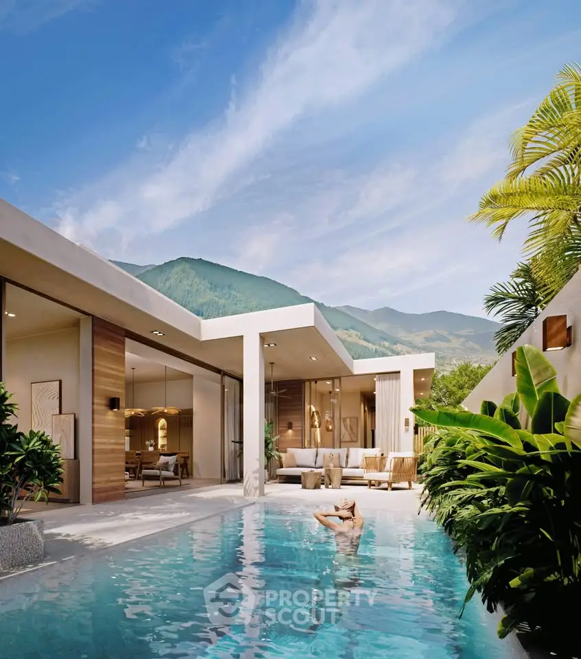 Luxurious modern villa with private pool and stunning mountain views, surrounded by lush greenery.
