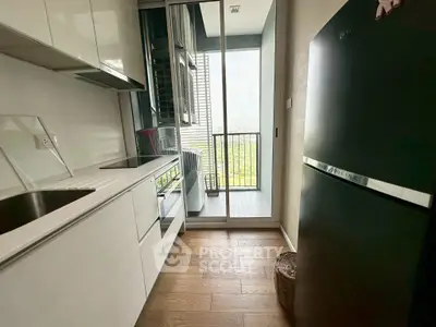 Modern kitchen with sleek design and balcony view