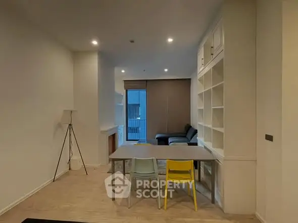 Modern living room with built-in shelves and cozy seating area