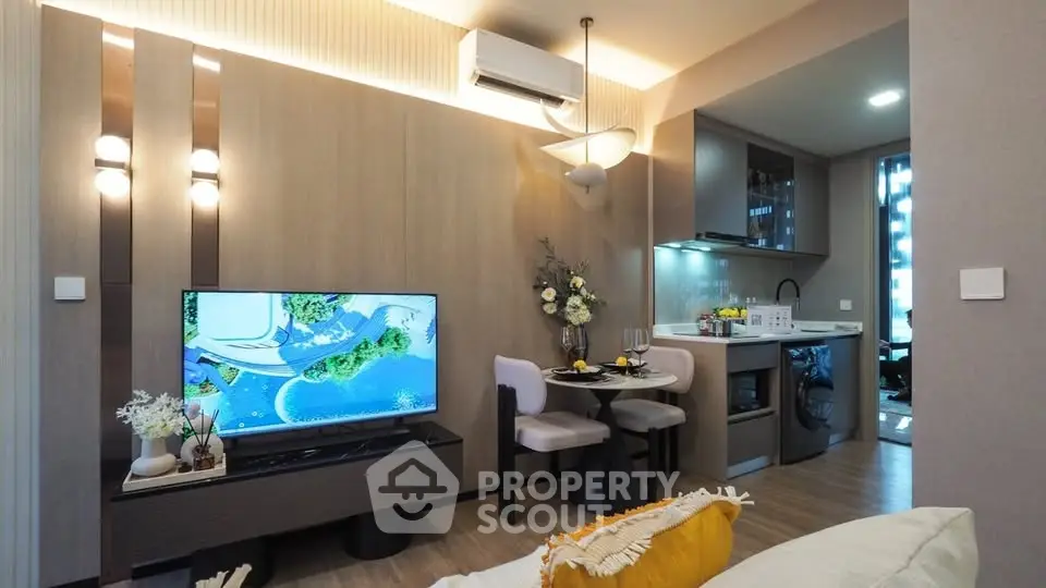 Modern living room with stylish decor and open kitchen layout