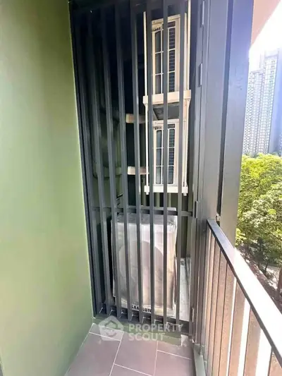 Modern balcony with sleek railing and urban view, perfect for city living.