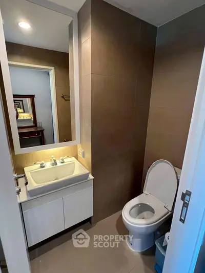 Modern bathroom with sleek fixtures and elegant lighting