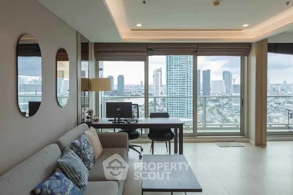 Spacious living room with city view, modern decor, and large windows in a high-rise apartment.