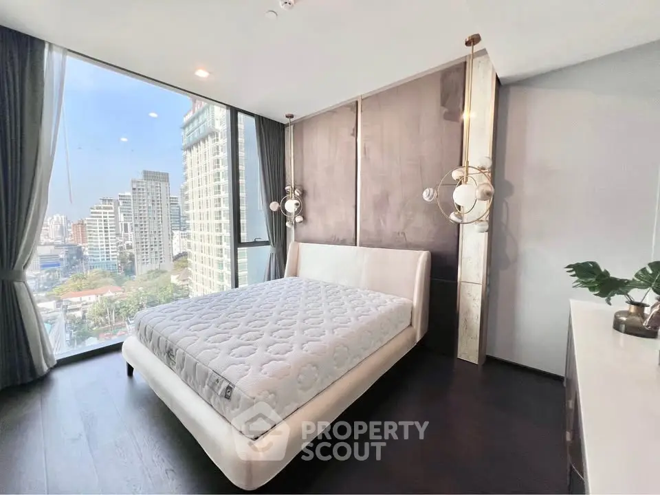 Luxurious bedroom with stunning city view in modern high-rise apartment