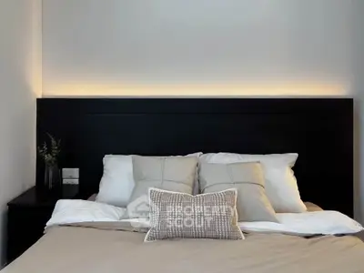 Cozy bedroom with modern headboard and soft lighting