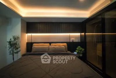 Luxurious bedroom with modern lighting and elegant decor, perfect for relaxation and comfort.
