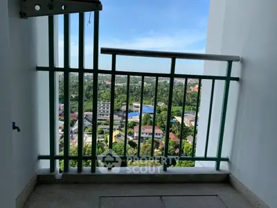 Stunning balcony view overlooking lush greenery and cityscape, perfect for relaxation and enjoying the outdoors.