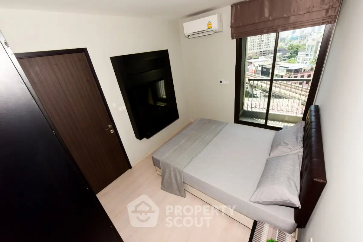 Modern bedroom with balcony view in urban apartment