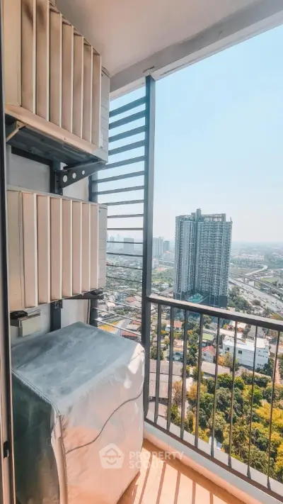 High-rise balcony with cityscape view and air conditioning units.
