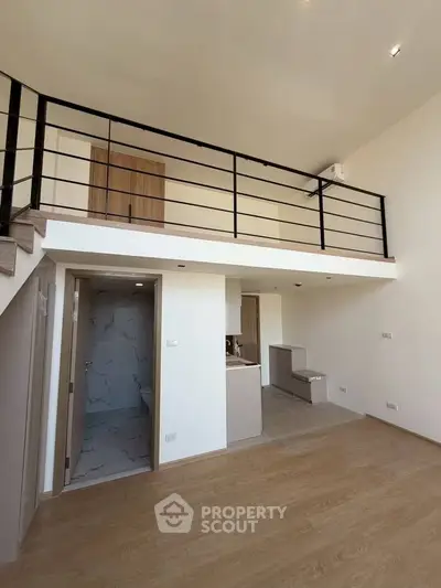 Modern loft apartment with mezzanine and sleek interior design