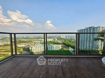 Stunning high-rise balcony with panoramic city and landscape views, perfect for relaxation and entertainment.