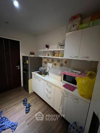 Cozy kitchen with modern cabinets and appliances in a compact layout