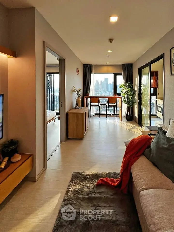 Modern living room with city view, open layout, and stylish decor