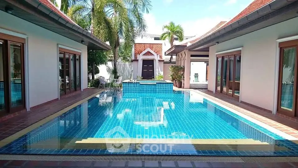 Luxurious villa with stunning pool and tropical landscaping