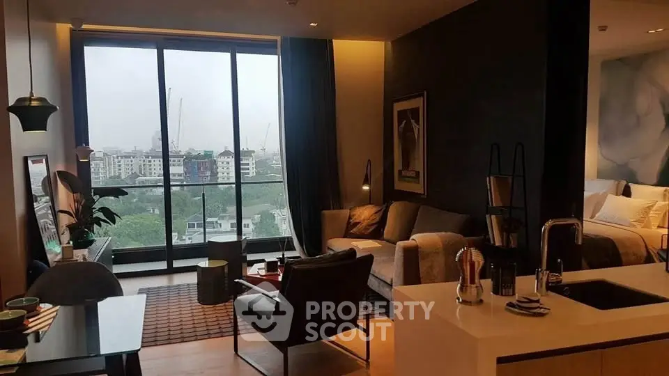 Modern living room with city view, stylish decor, and open layout in urban apartment.