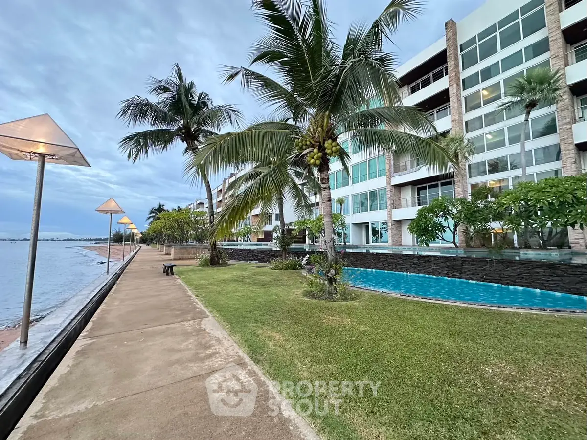 Stunning beachfront property with lush gardens and modern architecture, offering serene ocean views and luxury living.